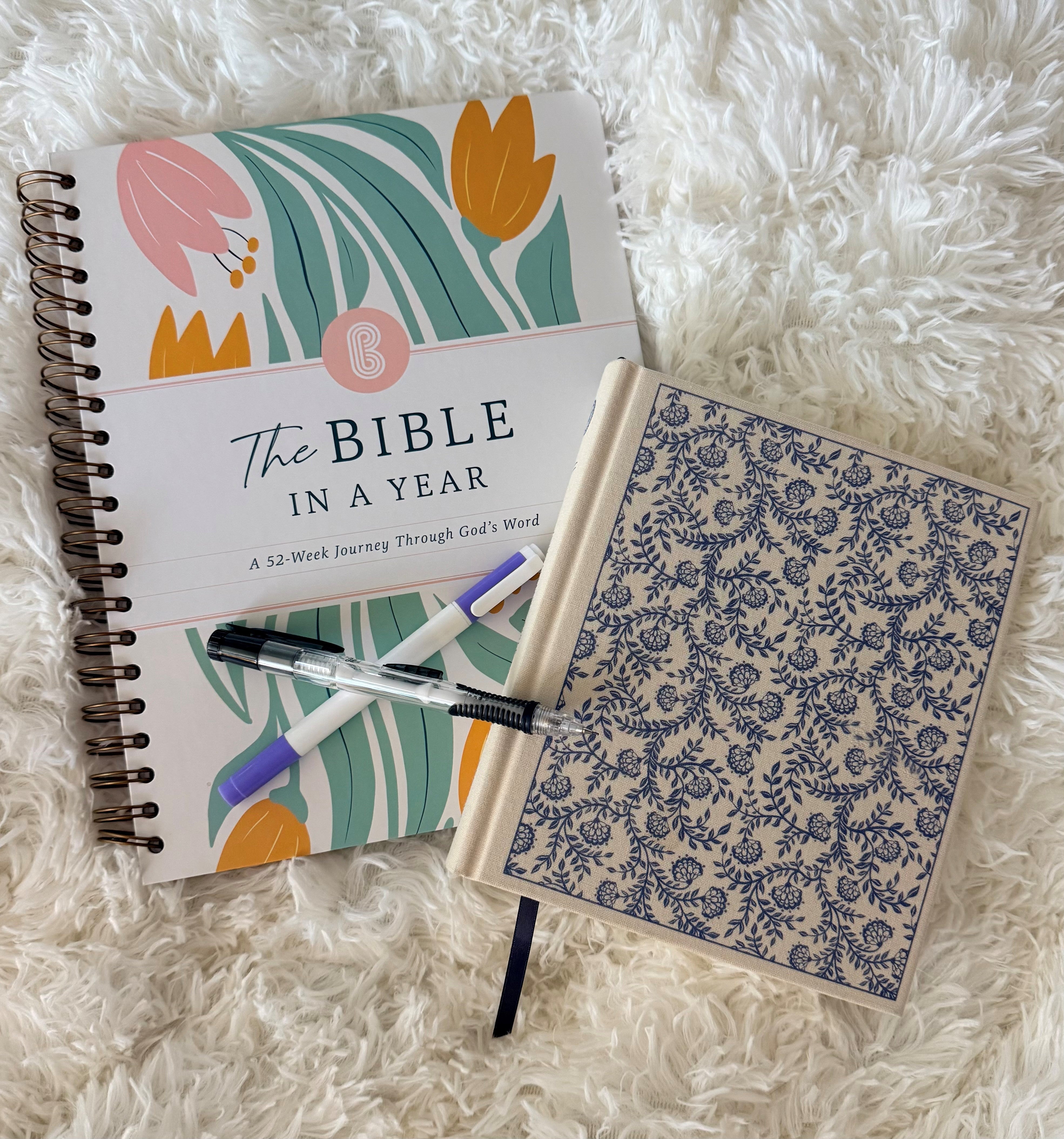 picture of a bible and The Spiral Bible on the bed