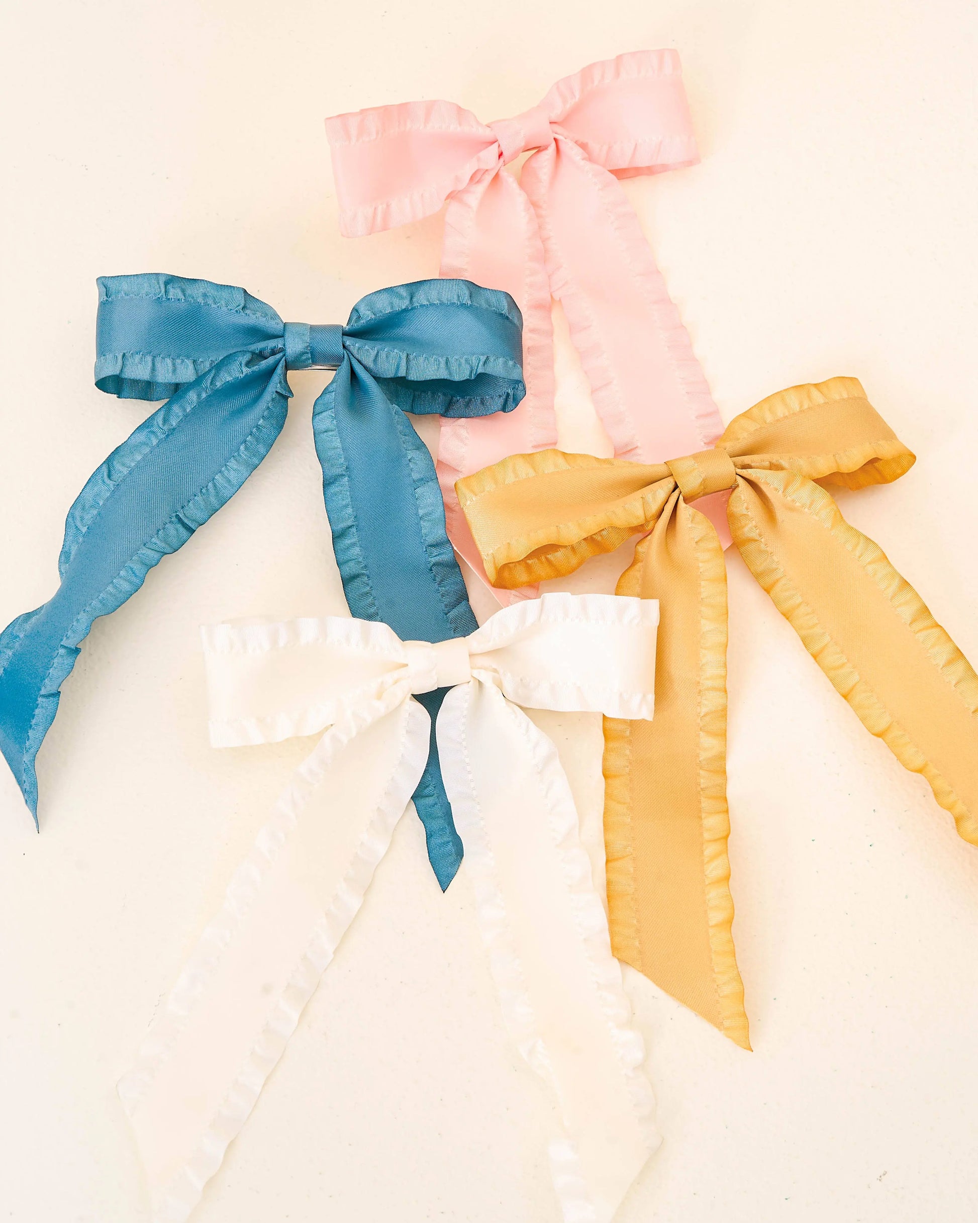 Cream Ruffle Hair Bow, soft fabric hair accessory for girls, adorable bow for ponytails or updos.