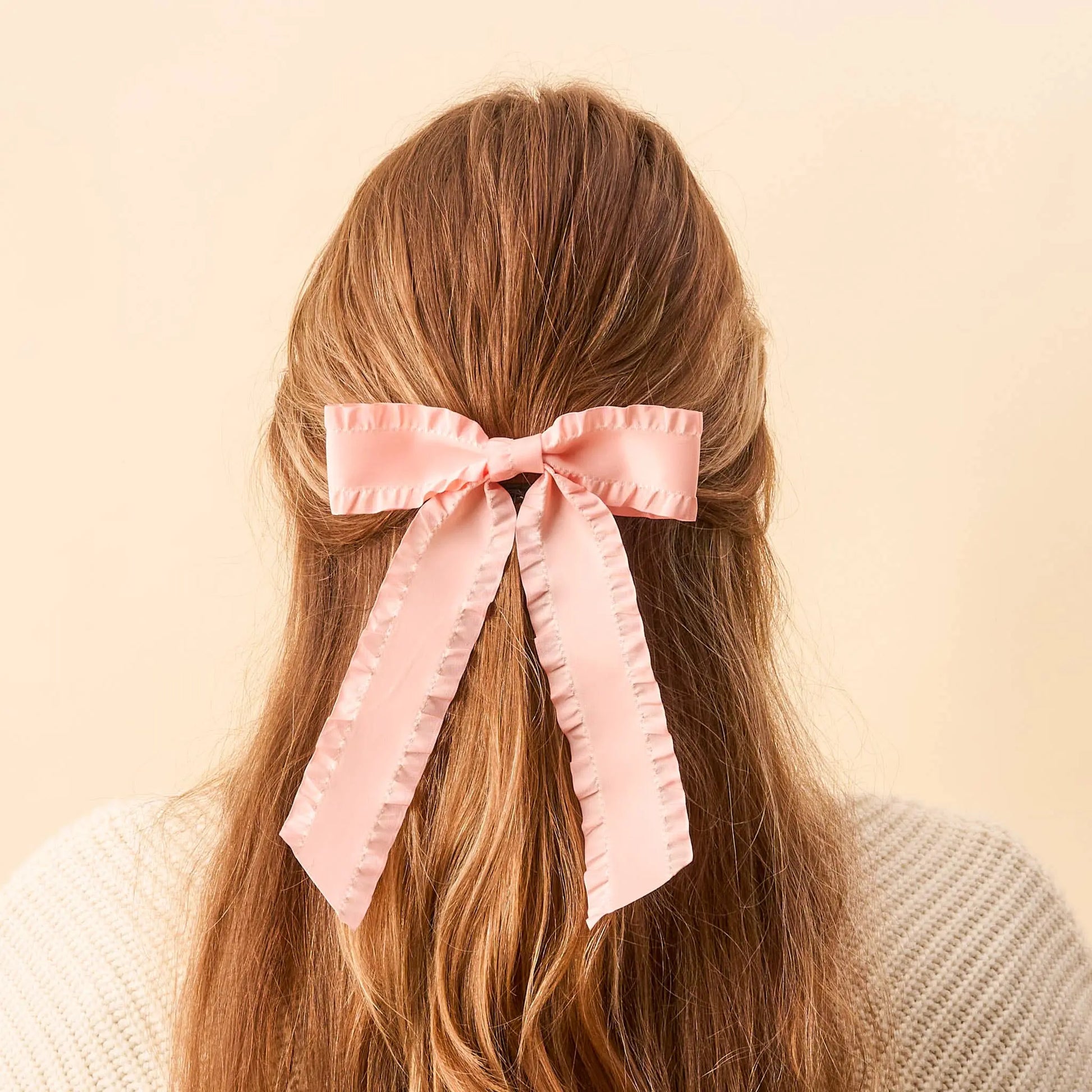 Ruffle Hair Bow Blush - soft pink hair accessory with delicate ruffle design for kids.