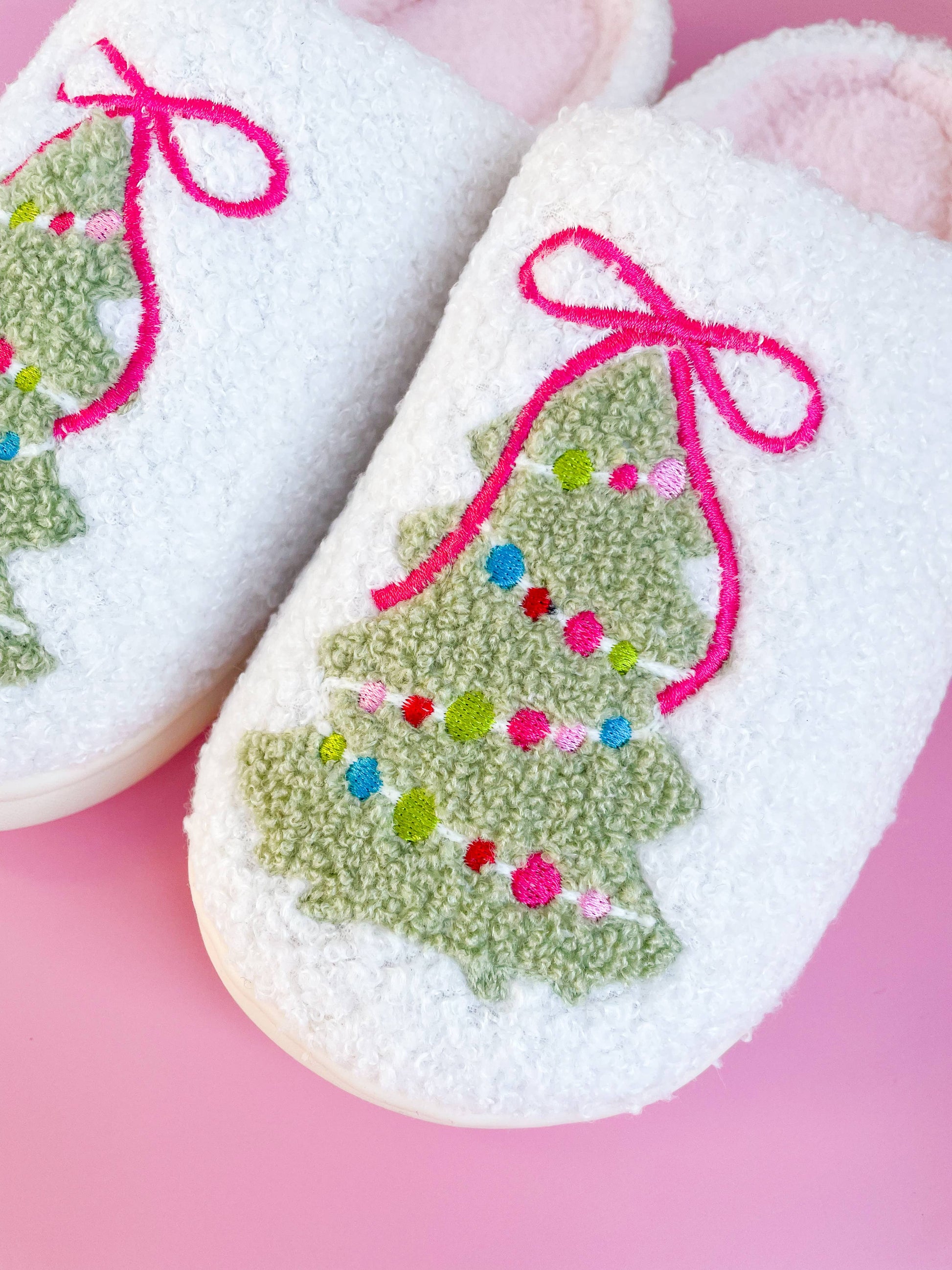 Buy cozy Pink Bow Christmas Tree Slippers for adults in small size, featuring soft plush material and festive design for h...