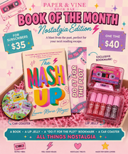 Promotional graphic for a Paper & Vine Book Bar subscription offering 'Book of the Month: Nostalgia Edition'. The image showcases a curated package containing 'The Mash Up' book by Laura McCray, a pink lip jelly set, a 'Do It For The Plot' bookmark, and a retro-themed car coaster, all arranged in pink paper shred.