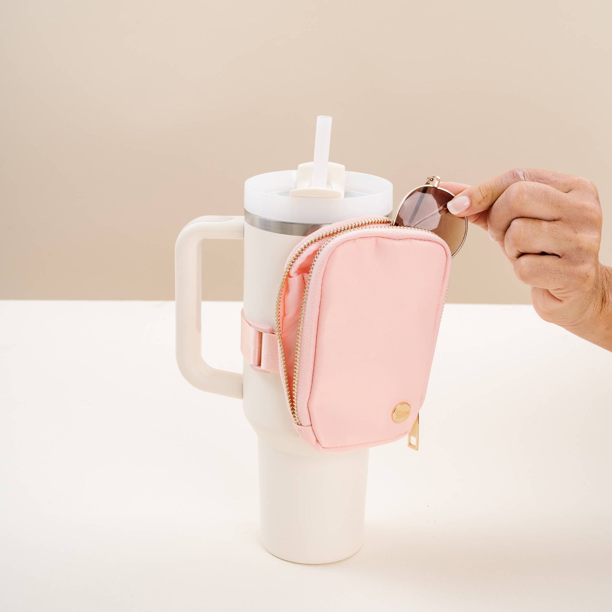 Blush Tumbler Fanny Pack in soft pink, durable nylon, adjustable strap, perfect for outdoor activities and travel