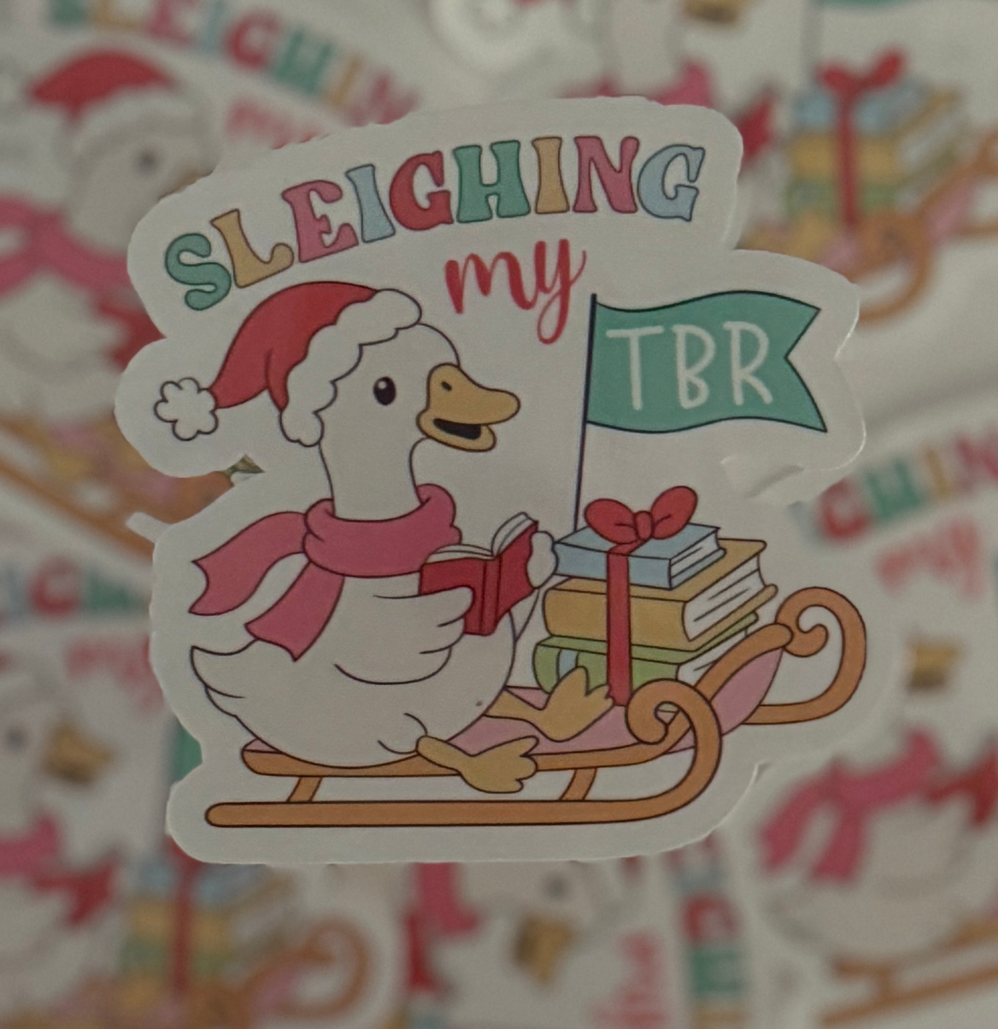 Sleighing My TBR Sticker, vibrant red holiday-themed, waterproof vinyl for book lovers, 3x3 inches