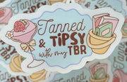 Tanned & Tipsy with my TBR sticker