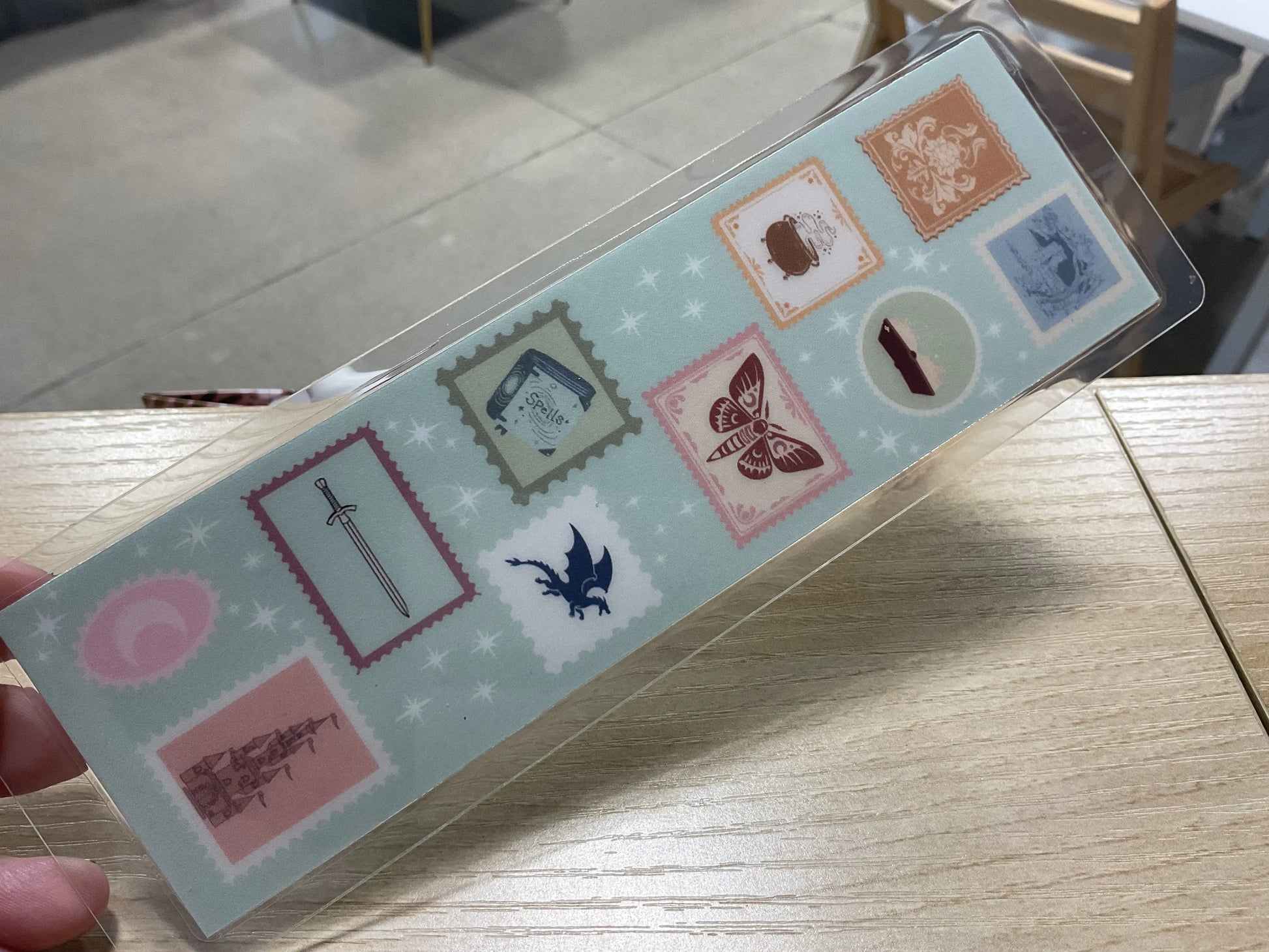Fantasy Stamp Bookmark in vibrant blue, dragon design, durable metal, perfect gift for book lovers