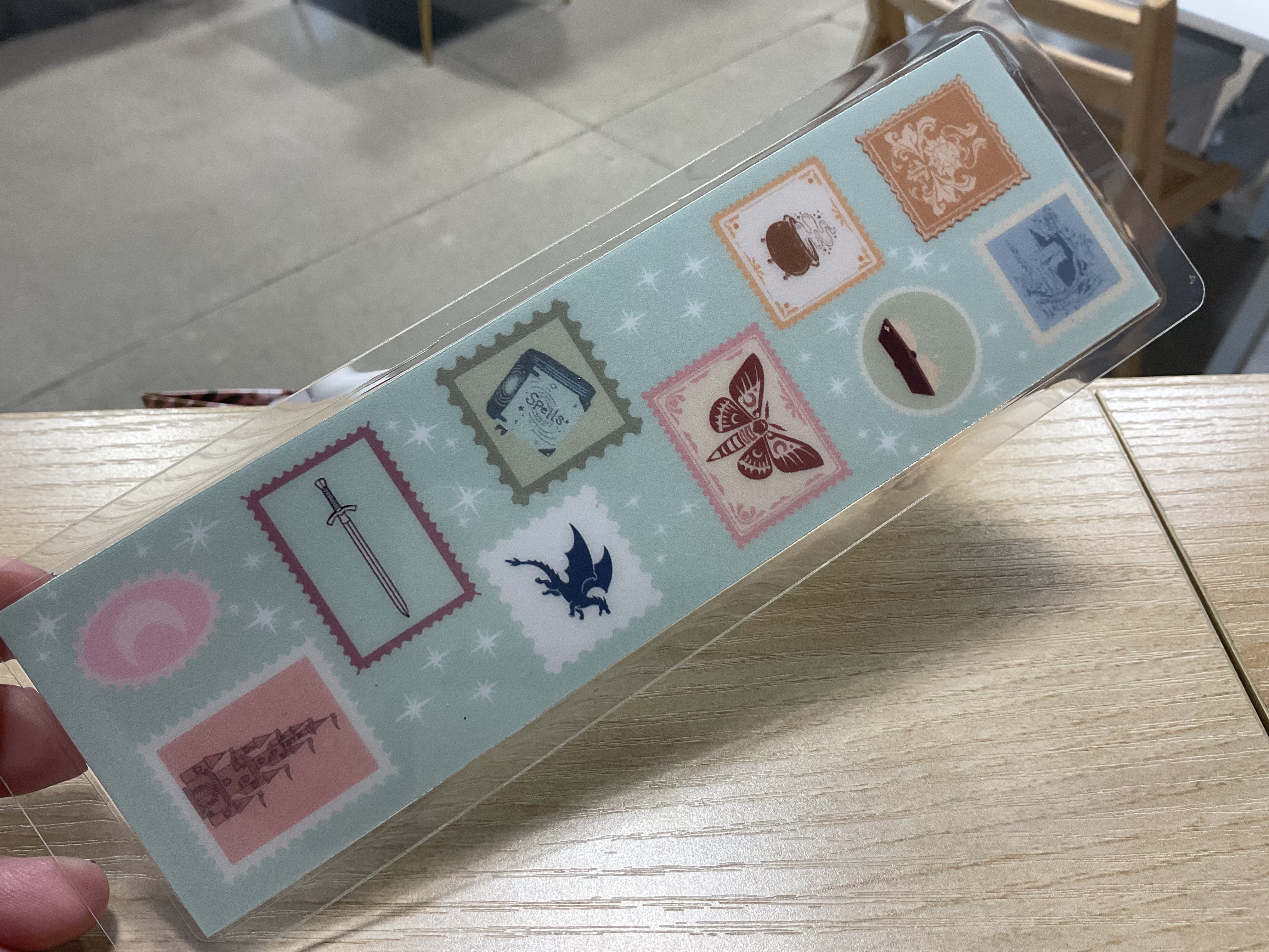 Fantasy Stamp Bookmark in vibrant blue, dragon design, durable metal, perfect gift for book lovers