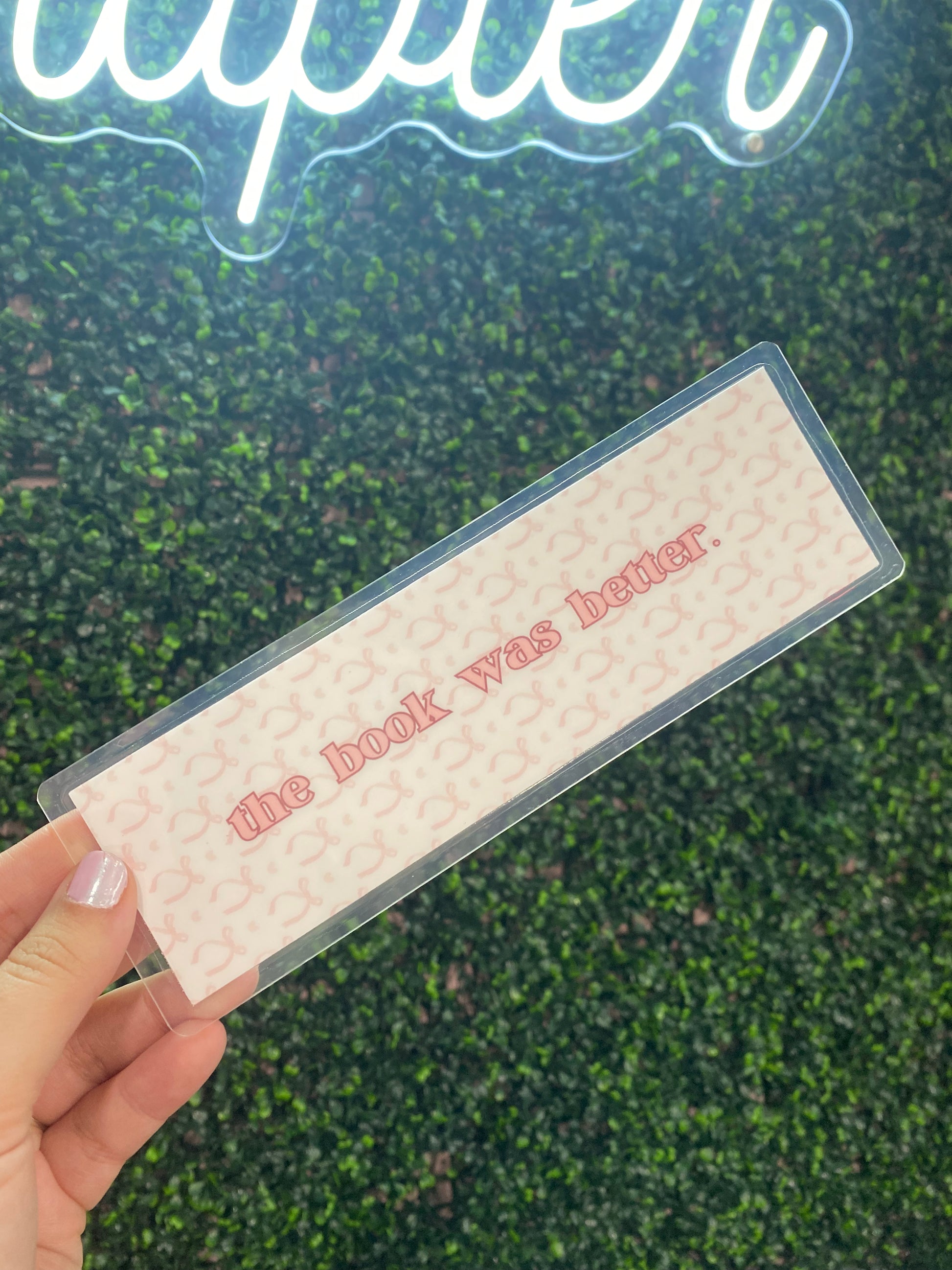 Buy "The Book Was Better Bookmark" in vibrant red, durable metal, perfect for avid readers and gift-giving.