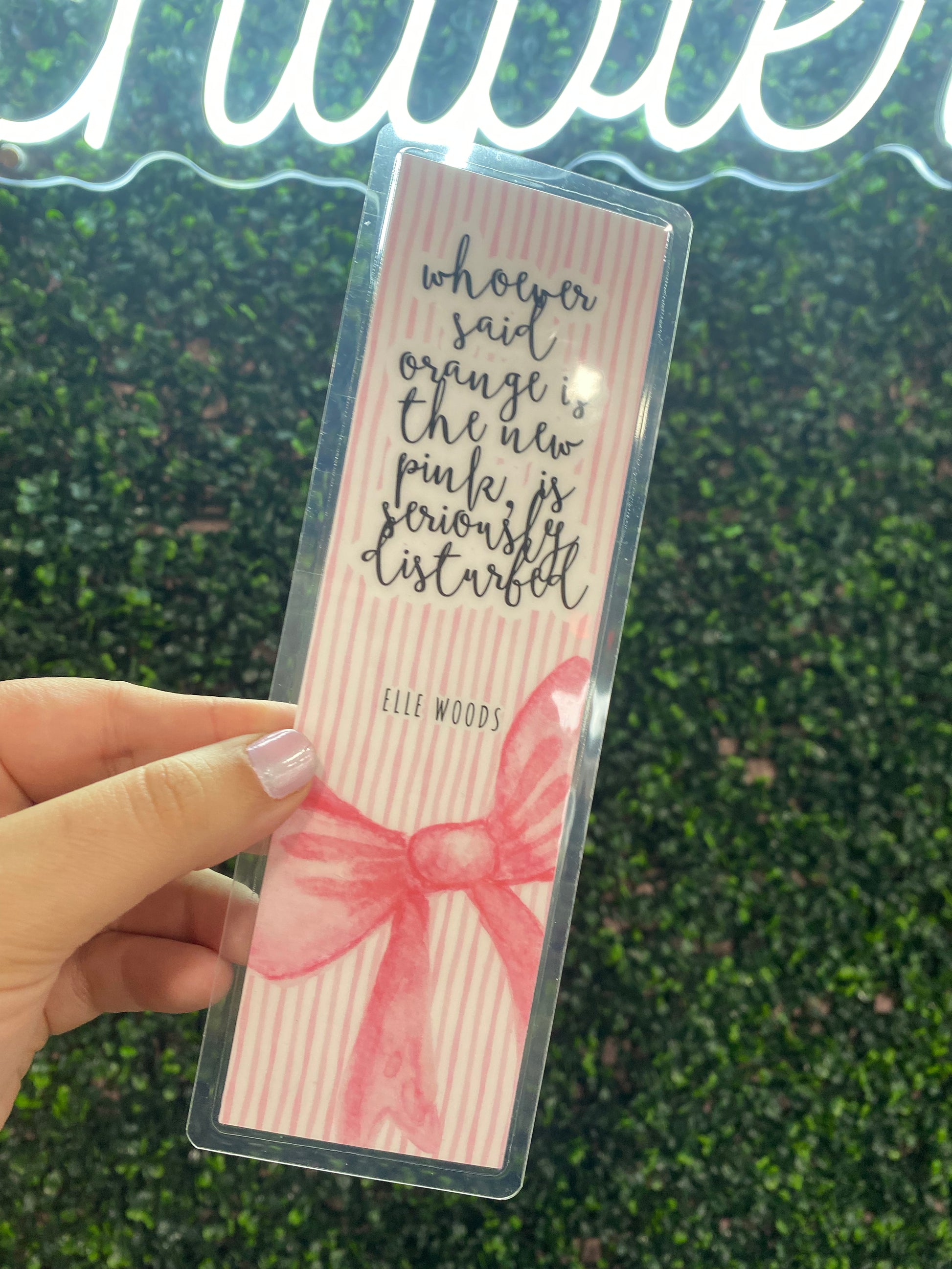 Orange is the New Pink Bookmark, vibrant neon orange, durable plastic, trendy accessory for book lovers