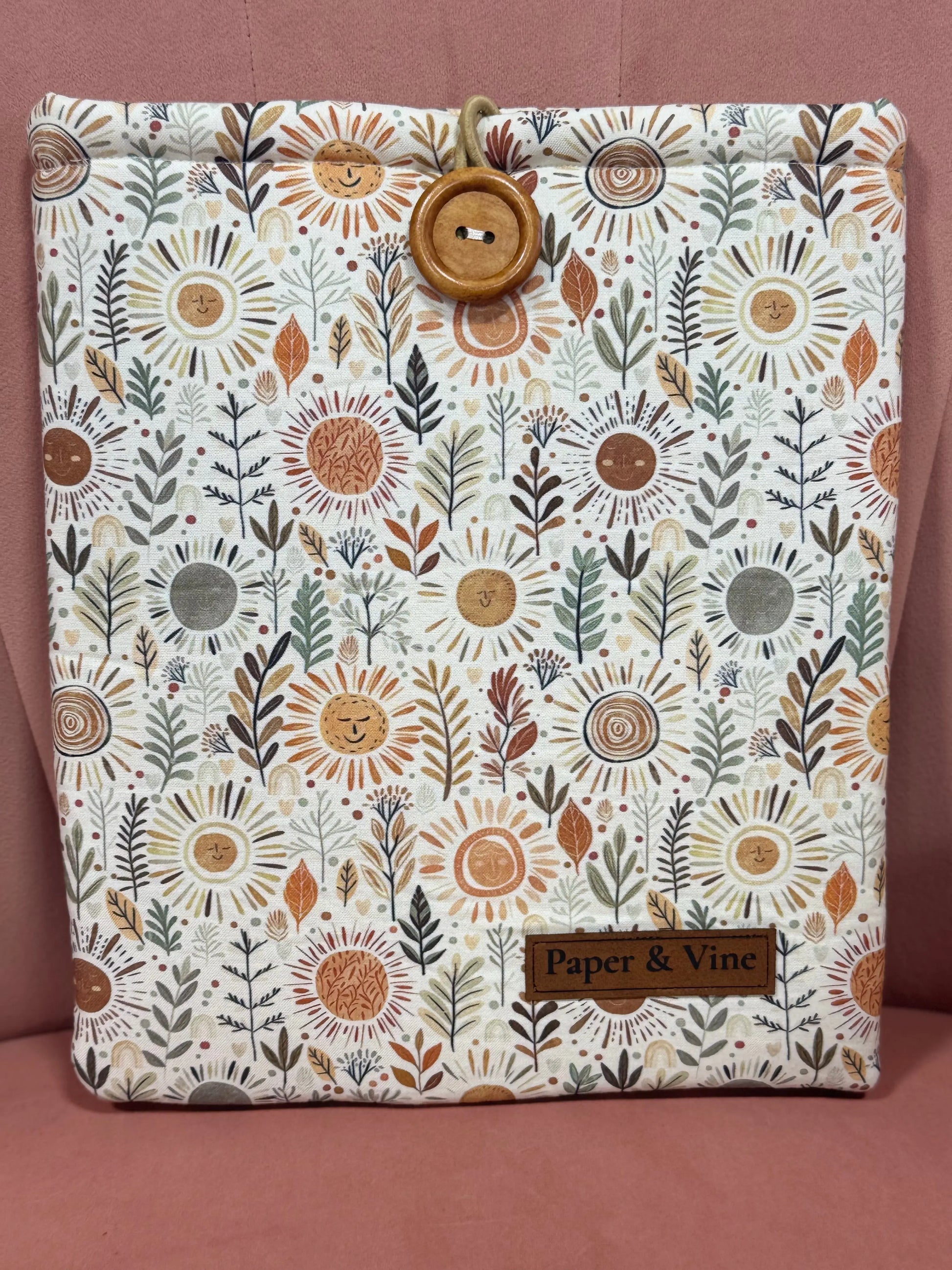Waterproof Book Sleeve in vibrant floral print, durable neoprene, fits up to 7-inch tablets and large novels