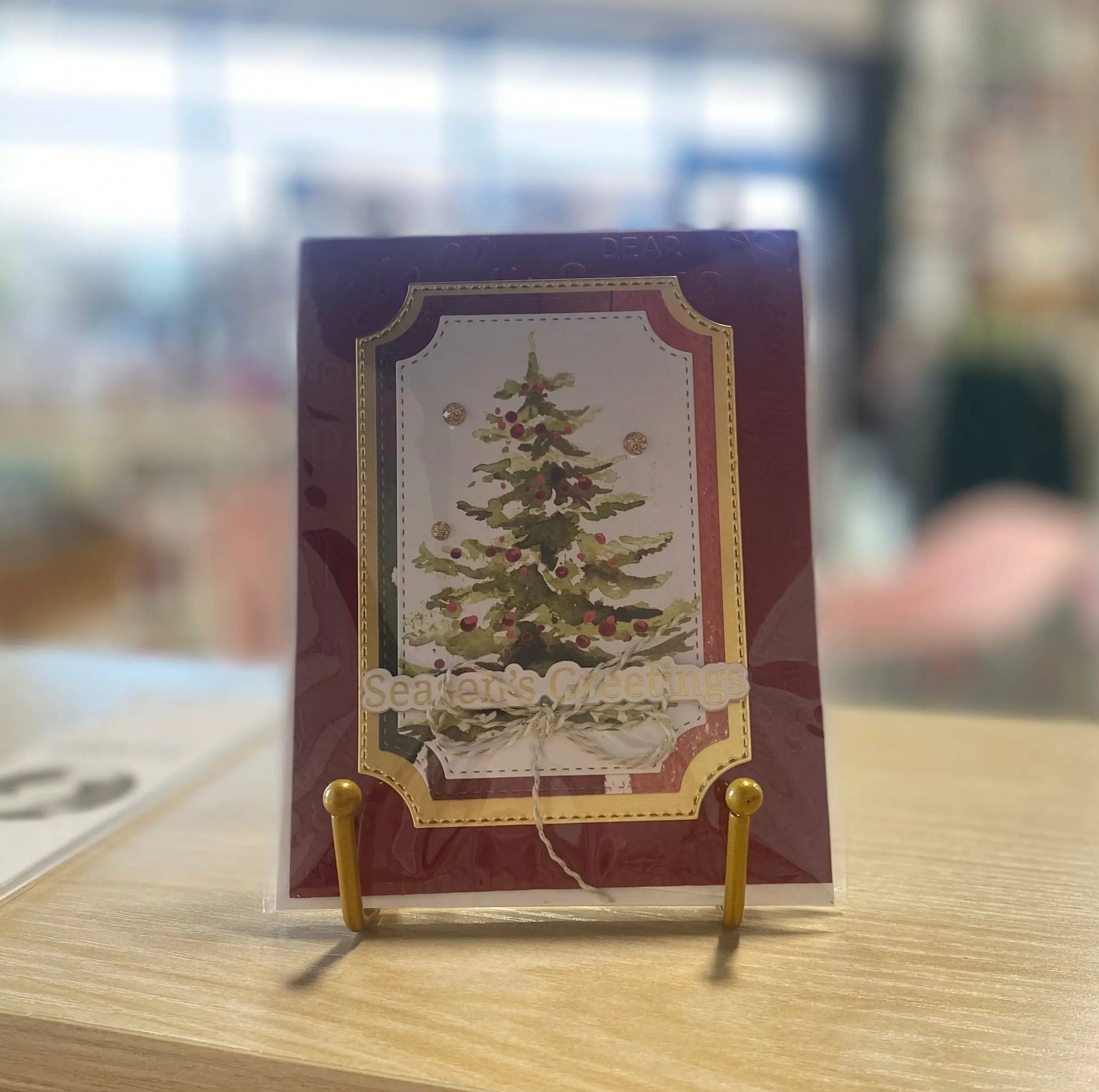 Buy Seasons Greetings Christmas Card with festive red and gold design, premium glossy paper, 5x7 inches, perfect for holid...