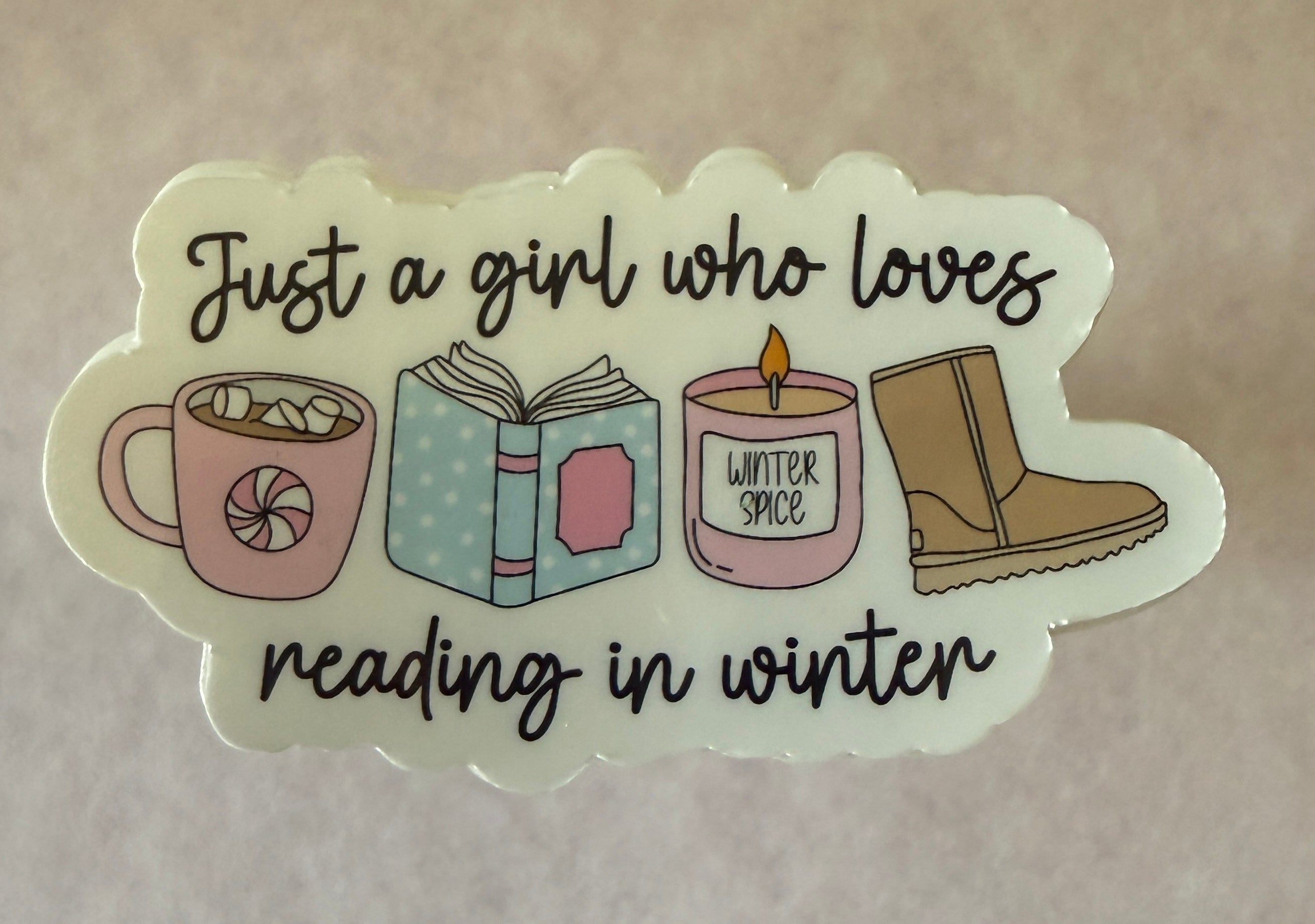 Winter-themed Reading in Winter Sticker featuring cozy book and snowflake design, waterproof vinyl, perfect for laptops an...
