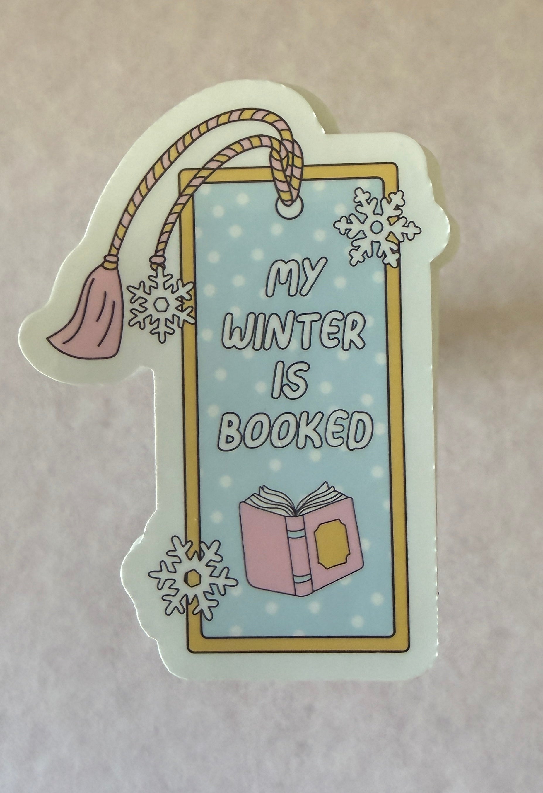 Buy waterproof My Winter is Booked Sticker, perfect for laptops and notebooks, featuring cozy reading nook design.