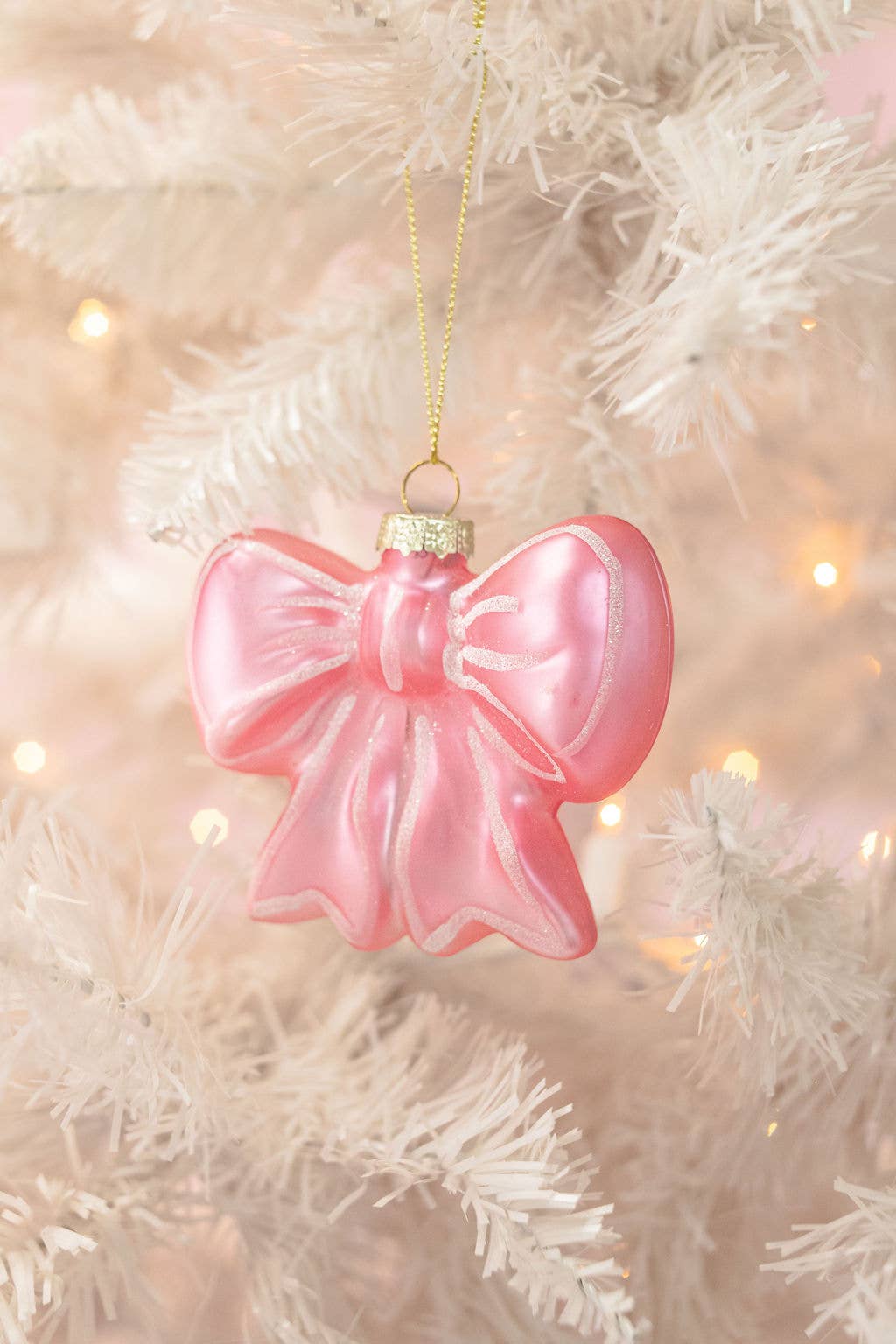Buy hand-blown Pretty Pink Bow Glass Christmas Ornament, perfect for holiday decor, shimmering delicate design