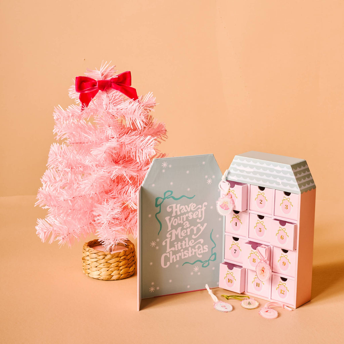 Coquette Christmas Ornament Advent Calendar with 24 unique holiday-themed pieces, festive colors, and durable design