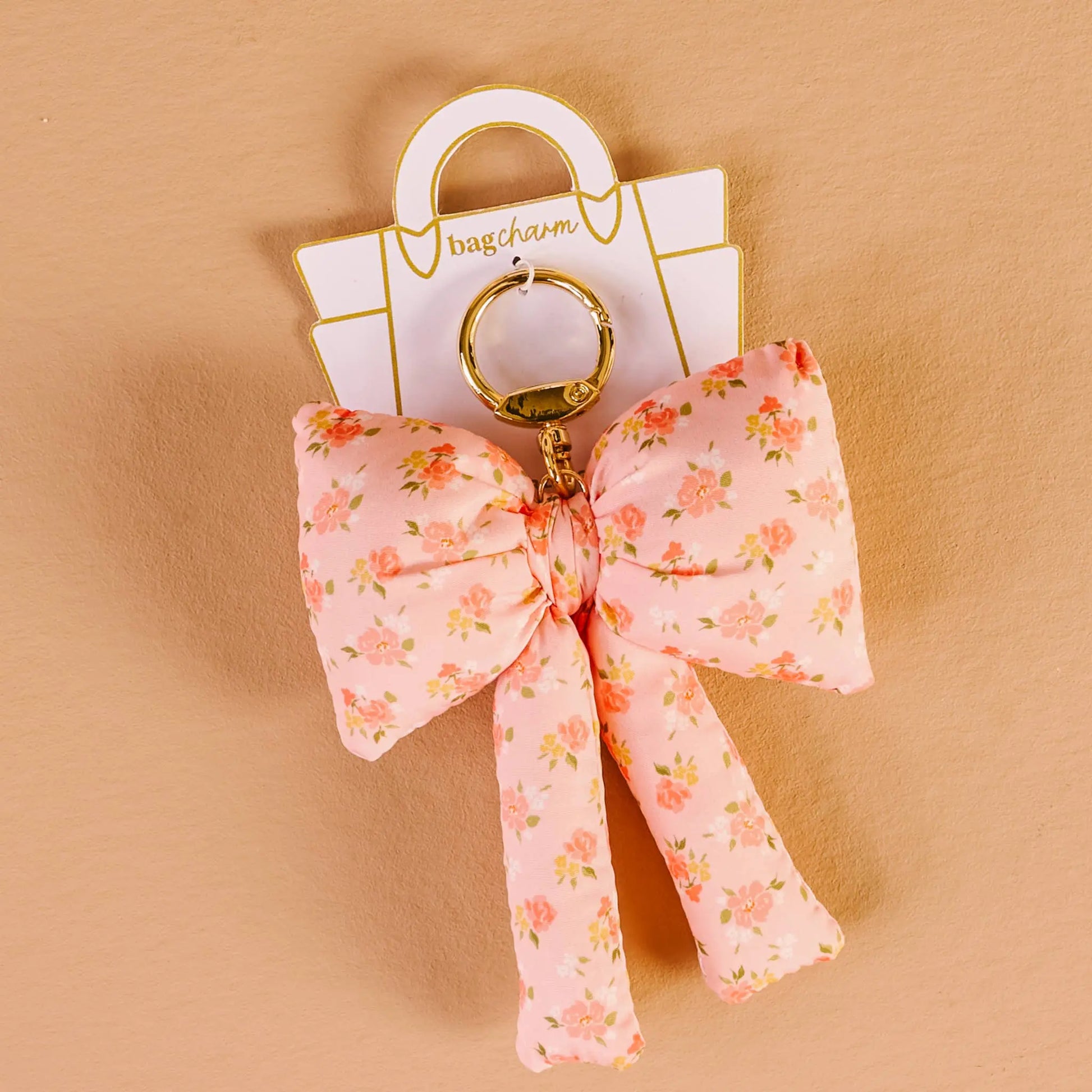 Peachy Petals Puffy Bow Bag Charm in soft pink, floral design, luxury accessory for handbags & purses, perfect gift idea.