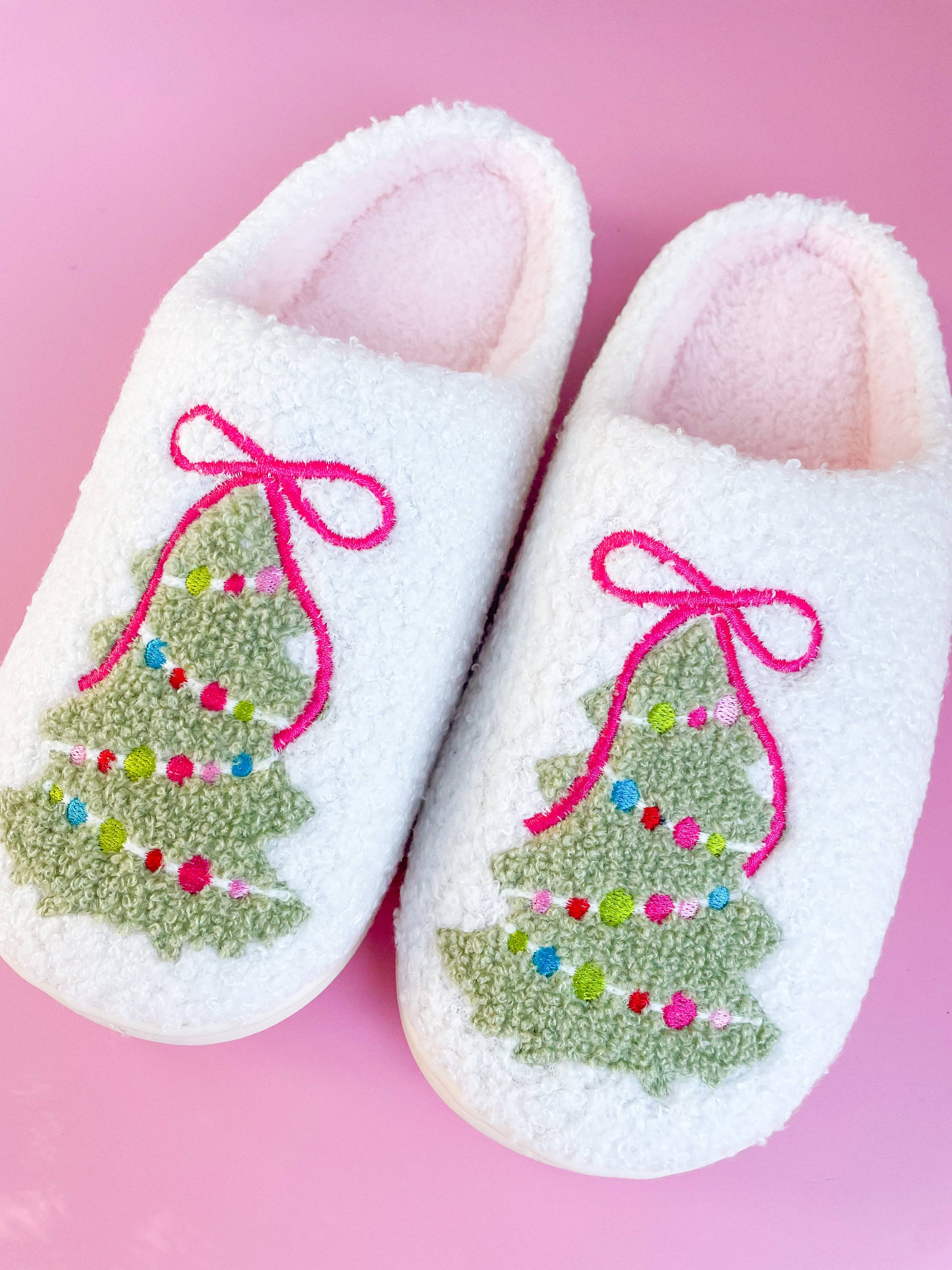 Buy cozy Pink Bow Christmas Tree Slippers for adults in small size, featuring soft plush material and festive design for h...
